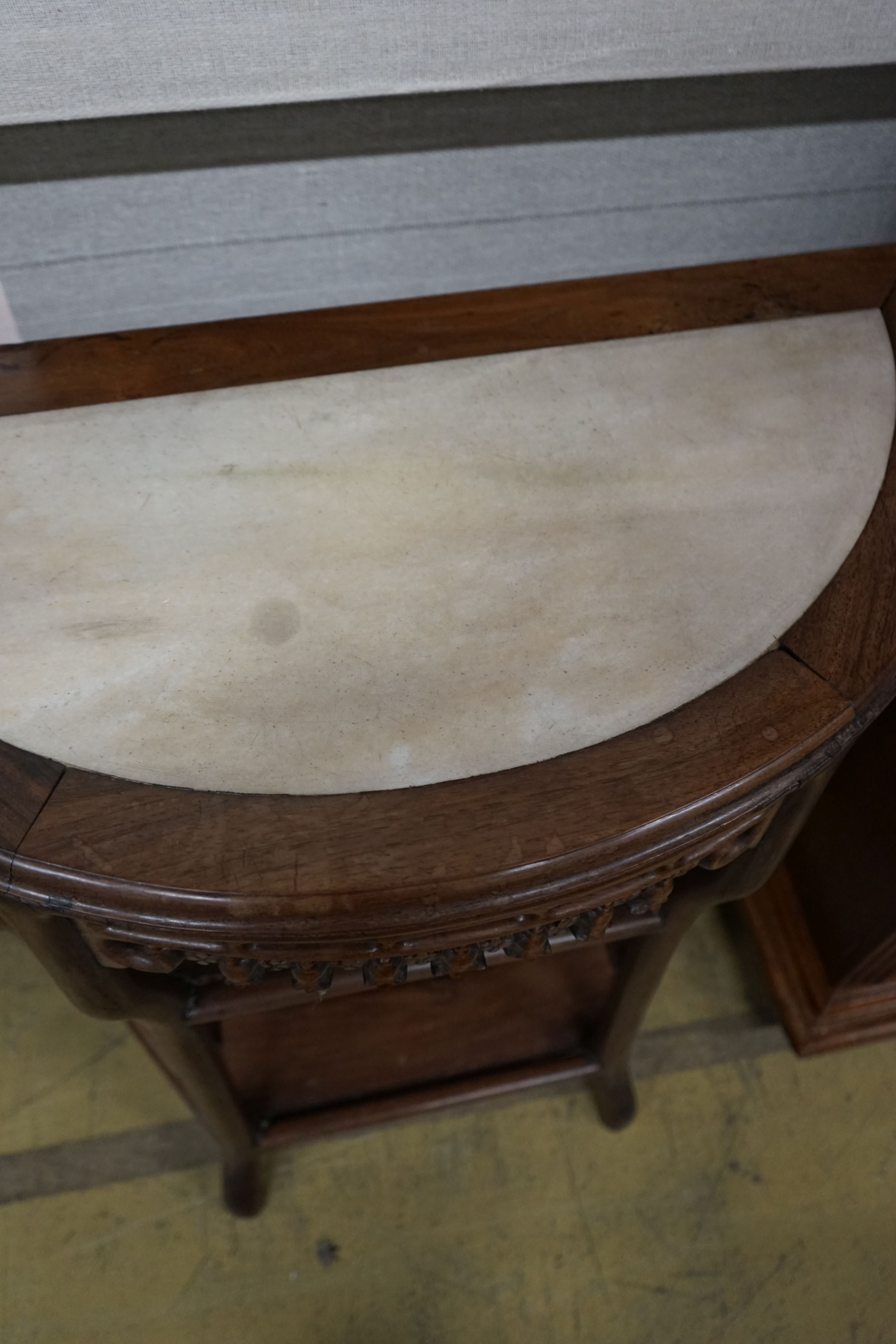 A pair of Chinese marble-topped demi lune console tables, width 82cm, depth 40cm, height 80cm
